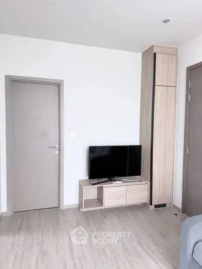 Modern living room with sleek TV stand and minimalist decor