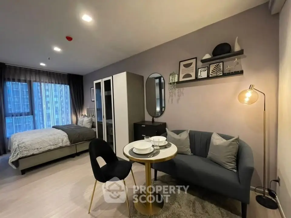 Modern studio apartment with cozy living area and stylish decor