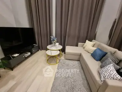 Modern living room with cozy sectional sofa and large TV