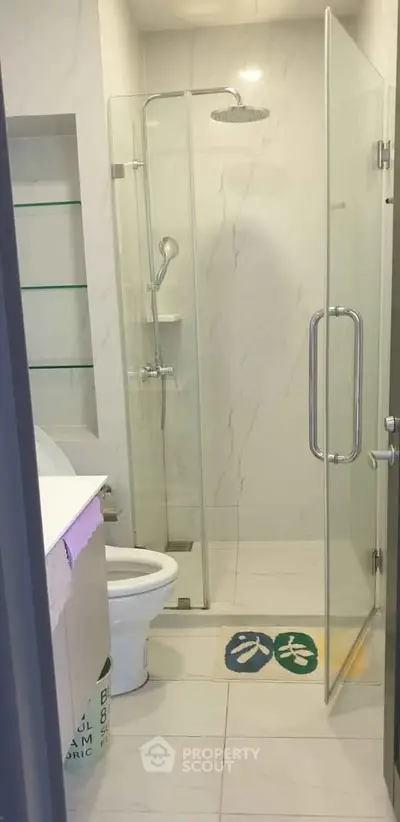 Modern bathroom with glass shower enclosure and sleek design