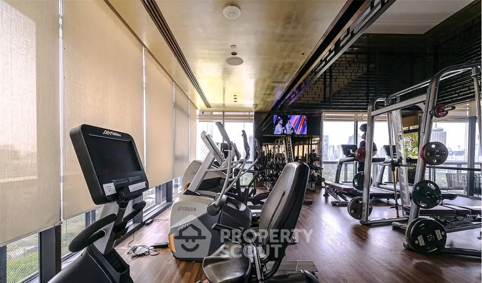 Modern gym with city view and state-of-the-art fitness equipment