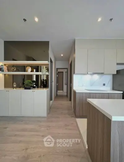 Modern kitchen with sleek cabinetry and open layout design