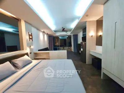 Spacious modern bedroom with stylish lighting and sleek furnishings