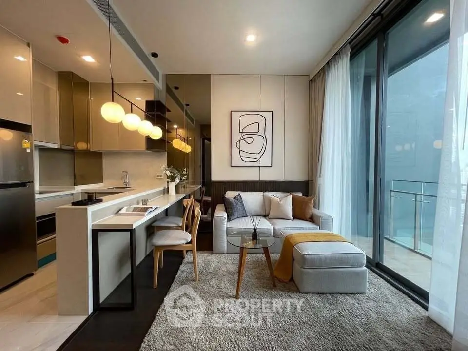 Modern open-layout living room with stylish kitchen and cozy seating area, featuring floor-to-ceiling windows.