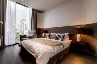 Luxurious modern bedroom with city view, featuring elegant decor and large windows for natural light.
