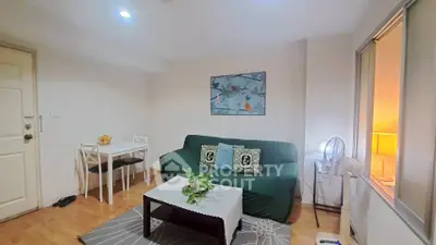 Cozy living room with modern decor and dining area, perfect for relaxation and entertaining.