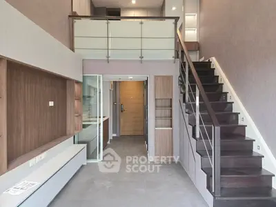Modern duplex apartment with sleek staircase and open layout
