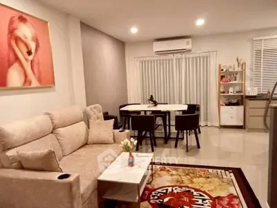 Stylish living room with modern decor and elegant dining area