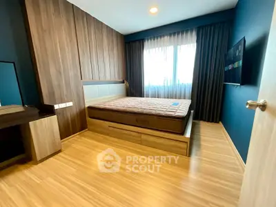 Modern bedroom with wooden flooring and stylish decor