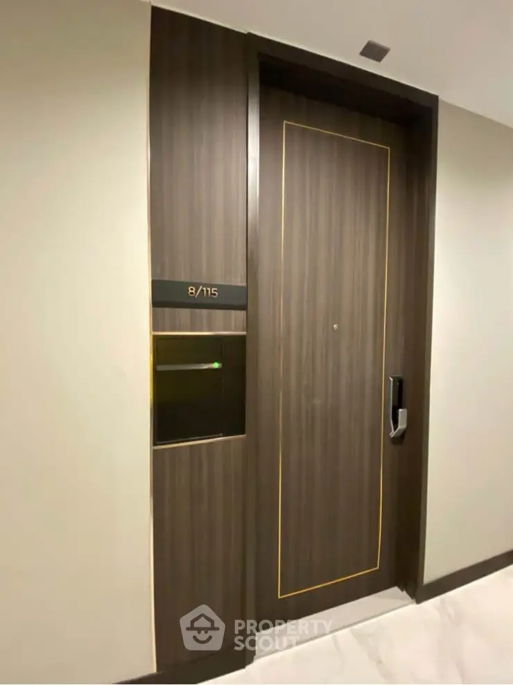 Modern apartment entrance with sleek wooden door and electronic lock