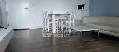 Modern living room with sleek furniture and wooden flooring