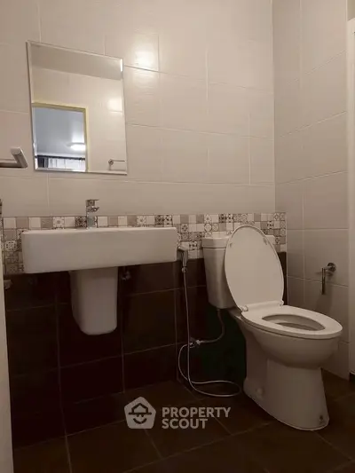 Modern bathroom with sleek fixtures and stylish tile design, perfect for a contemporary home.