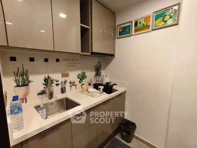 Modern compact kitchen with sleek cabinets and stylish decor