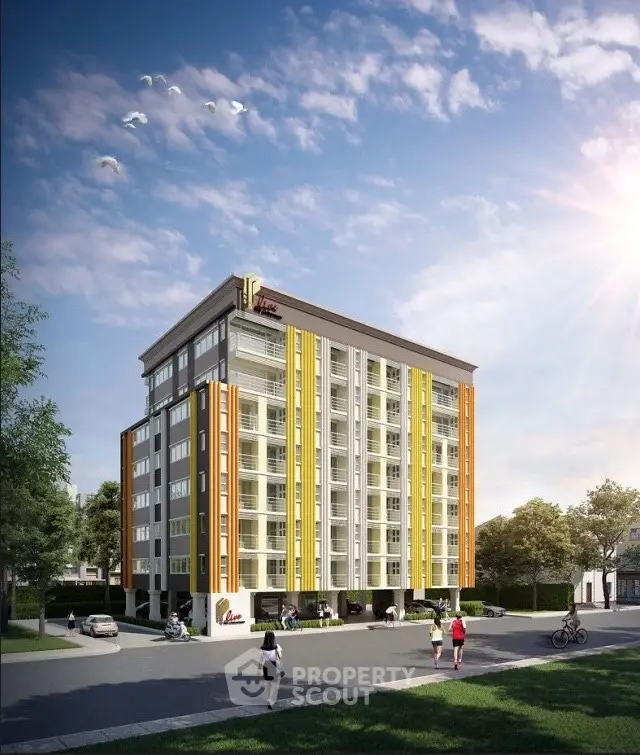 Modern apartment building with vibrant facade and sunny surroundings, ideal for urban living.