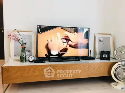 Modern living room with sleek wooden TV stand and stylish decor