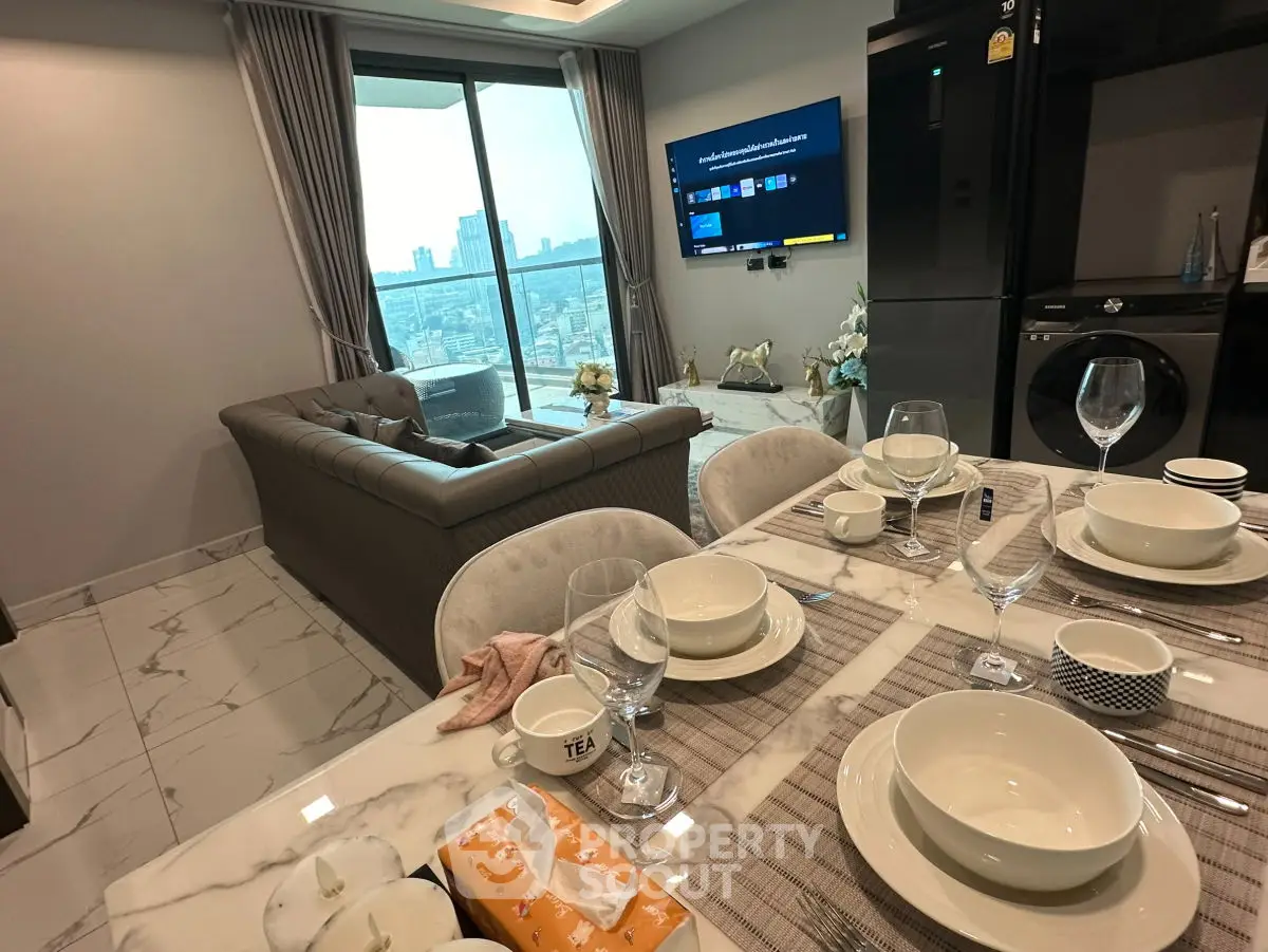 Luxurious open-plan living room with city view and elegant dining setup