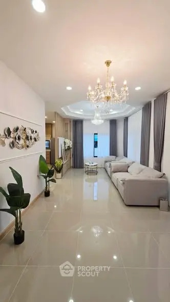 Elegant living room with chandelier and modern decor