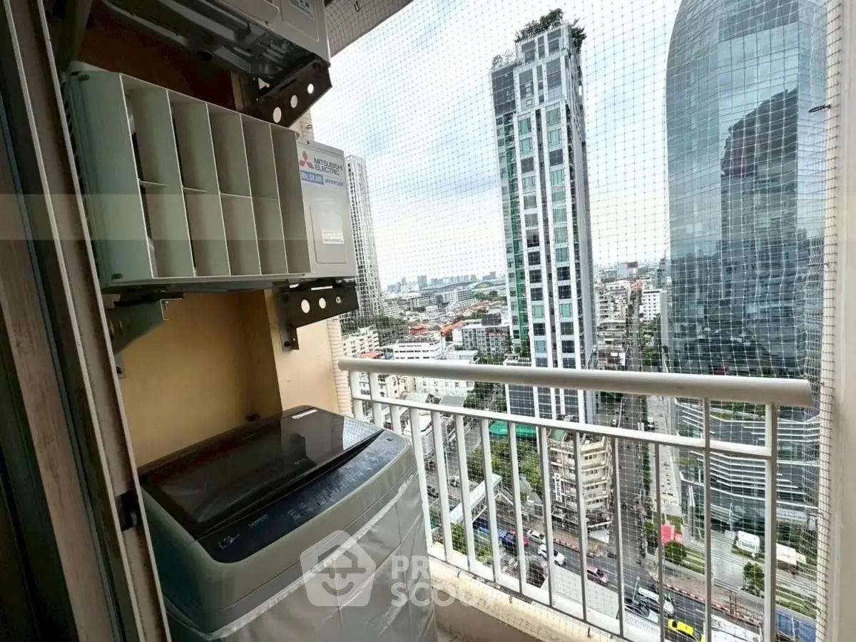 High-rise balcony with city view and washing machine setup.