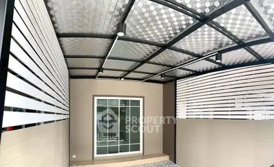 Modern covered patio with sleek design and glass sliding doors