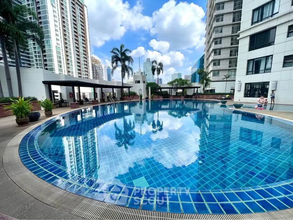 Luxurious high-rise condominium with stunning pool and city views.