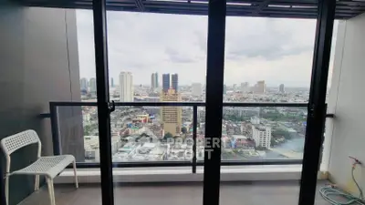Stunning cityscape view from a modern balcony in a high-rise apartment.