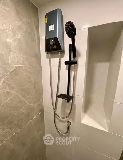 Modern bathroom with sleek shower unit and elegant tile design