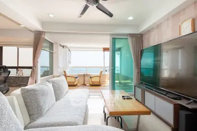 Spacious living room with ocean view and modern furnishings