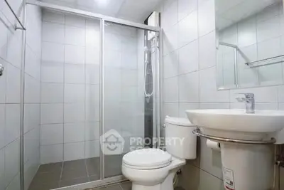 Modern bathroom with glass shower and sleek fixtures