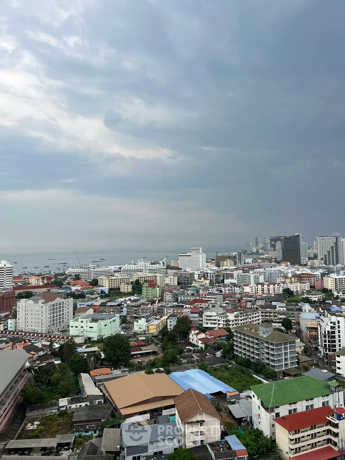 Stunning cityscape view with skyline and ocean backdrop, perfect for urban living.