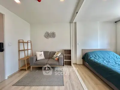 Modern studio apartment with cozy living area and stylish bedroom