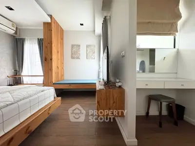 Modern bedroom with wooden accents and natural light