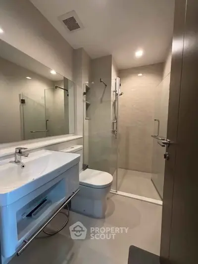 Modern bathroom with sleek design and glass shower enclosure