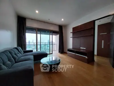 Spacious living room with city view and modern furniture