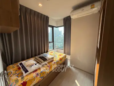 Cozy bedroom with city view and modern air conditioning unit.