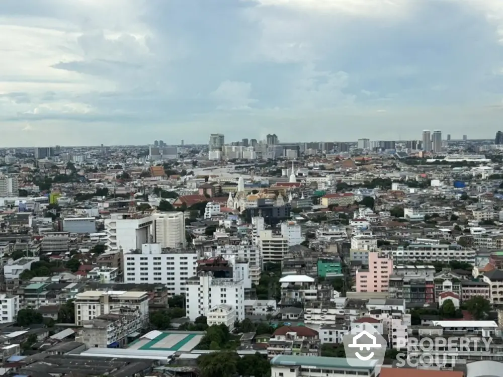 Stunning panoramic cityscape view from high-rise building in vibrant urban area.