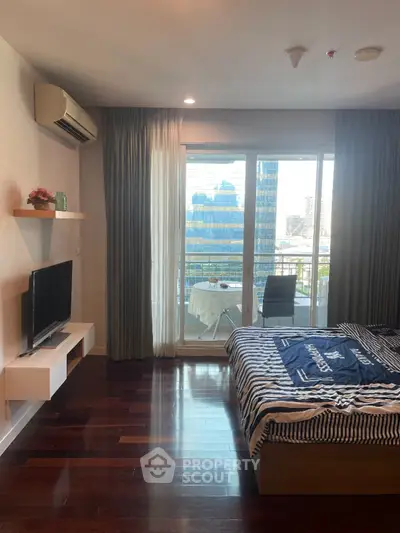 Modern bedroom with balcony view in urban apartment