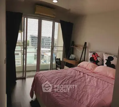 Cozy bedroom with balcony view in modern apartment