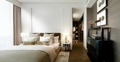 Luxurious modern bedroom with elegant decor and walk-in closet, featuring plush bedding and stylish lighting.