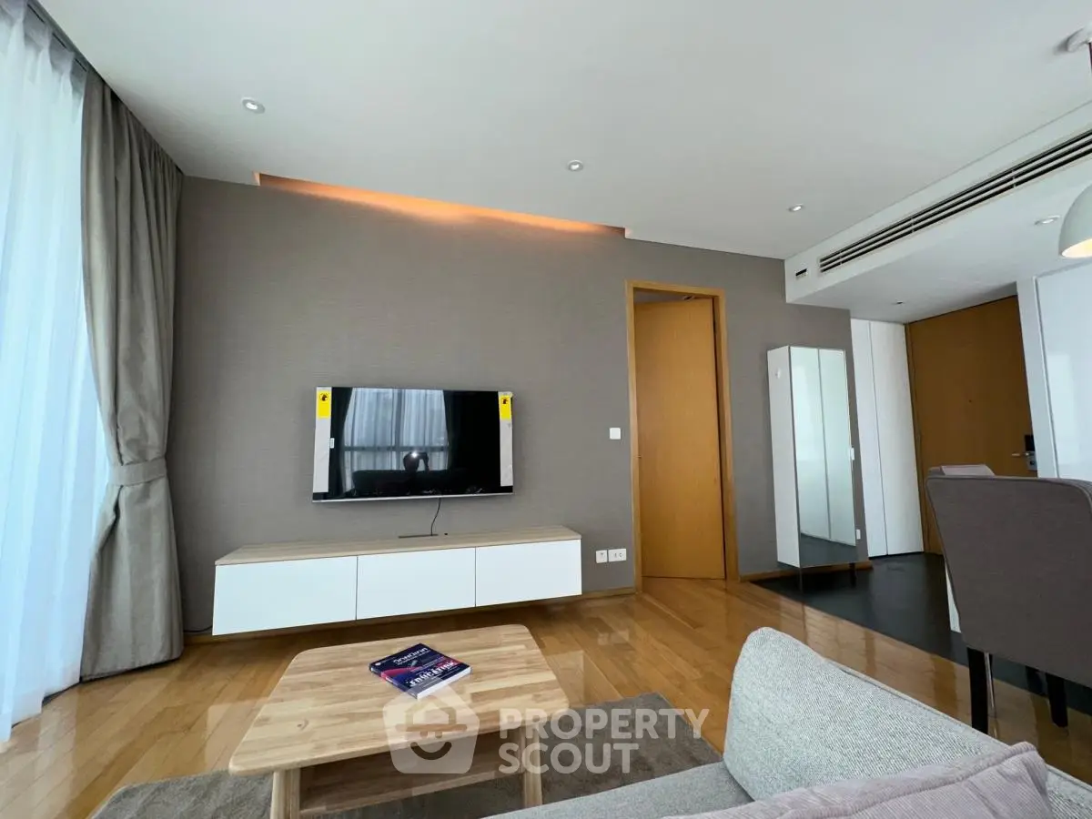 Modern living room with sleek TV setup and stylish furniture