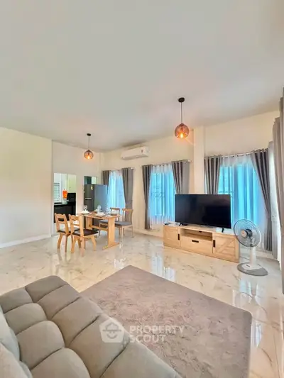 Spacious modern living room with elegant decor and natural light