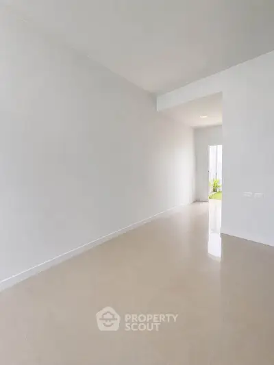 Spacious minimalist hallway with natural light and modern design