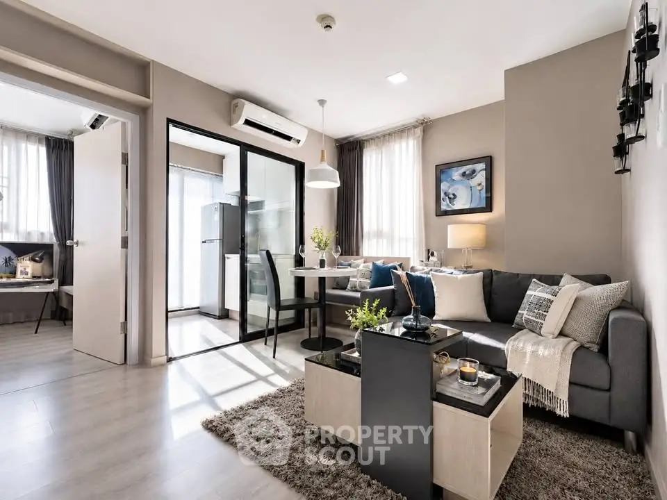 Modern living room with stylish decor and open layout in a cozy apartment.