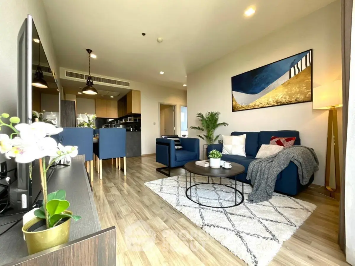 Modern living room with stylish decor, open layout, and cozy seating area in a contemporary apartment.