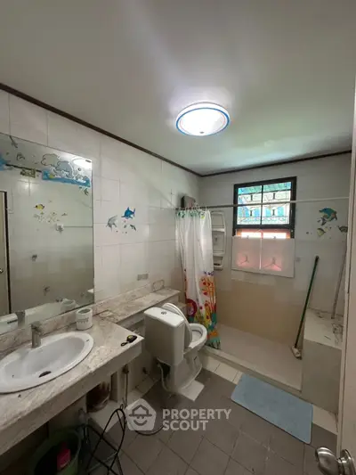 Spacious bathroom with modern fixtures and natural light