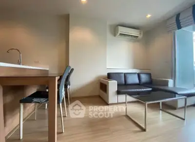 Modern living room with sleek furniture and air conditioning in a stylish apartment.