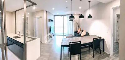 Modern open-plan living room with sleek kitchen and stylish dining area