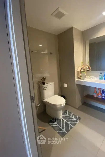 Modern bathroom with sleek fixtures and stylish decor in a contemporary home.