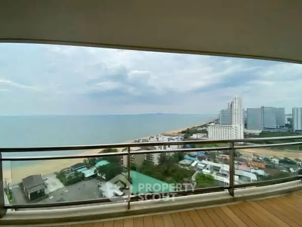 Stunning beachfront balcony view with city skyline and ocean horizon.
