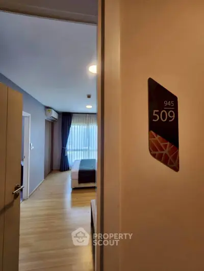 Modern bedroom with wooden flooring and stylish decor in apartment 509.