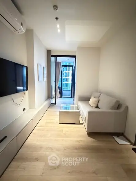 Modern living room with sleek design and balcony access